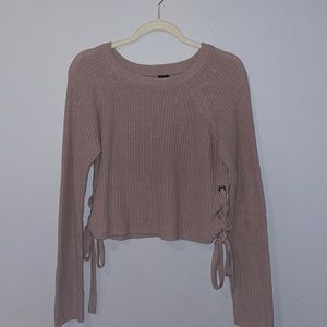 Light pink sweater with ties on both sides